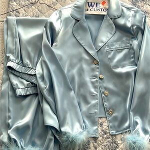 Blue satin pajamas either feather trim